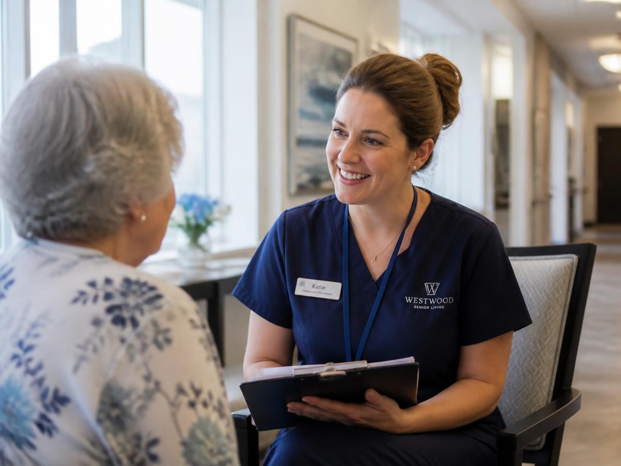 Admissions coordinator speaking with a senior resident